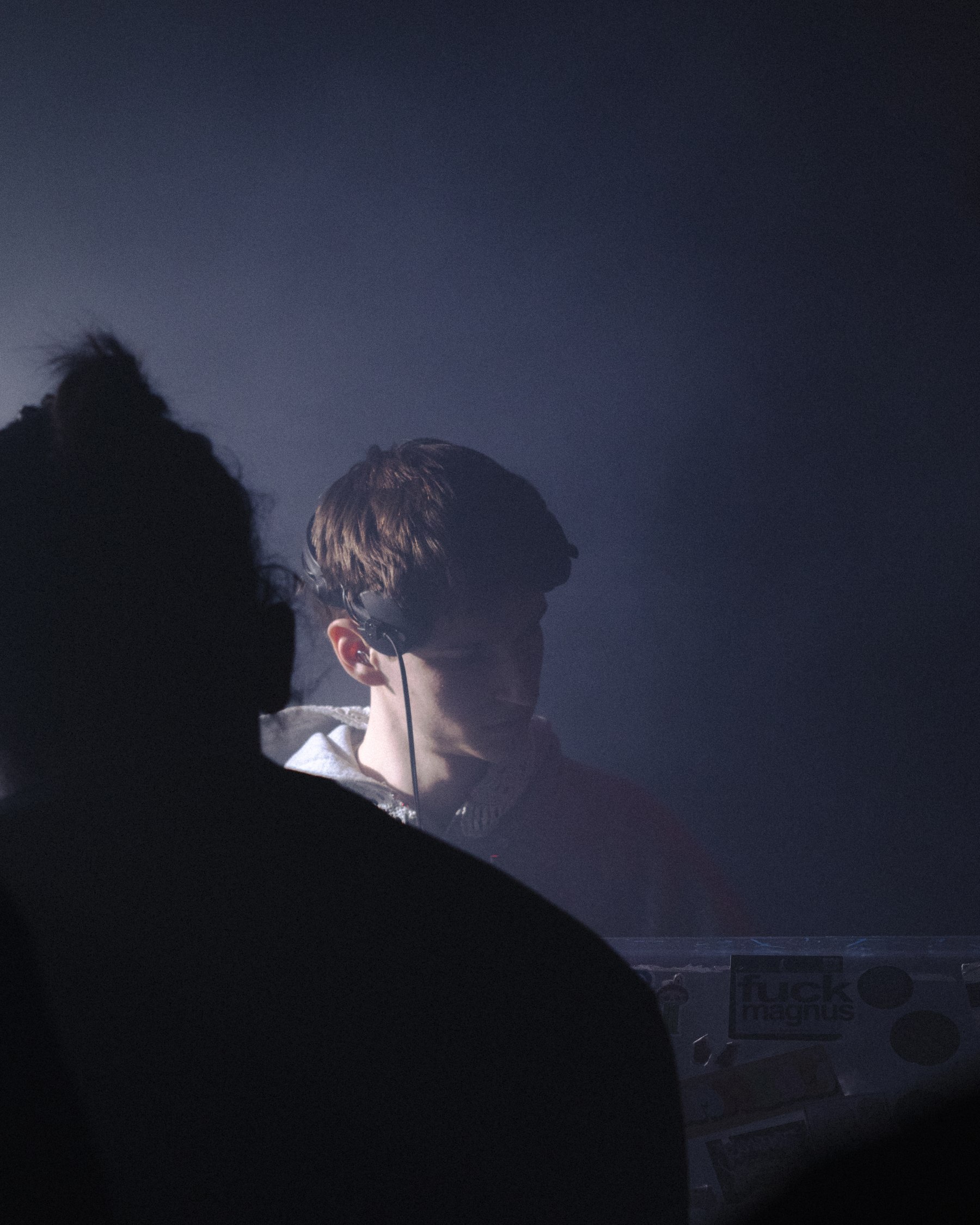 Vava performing at a show, blue lighting